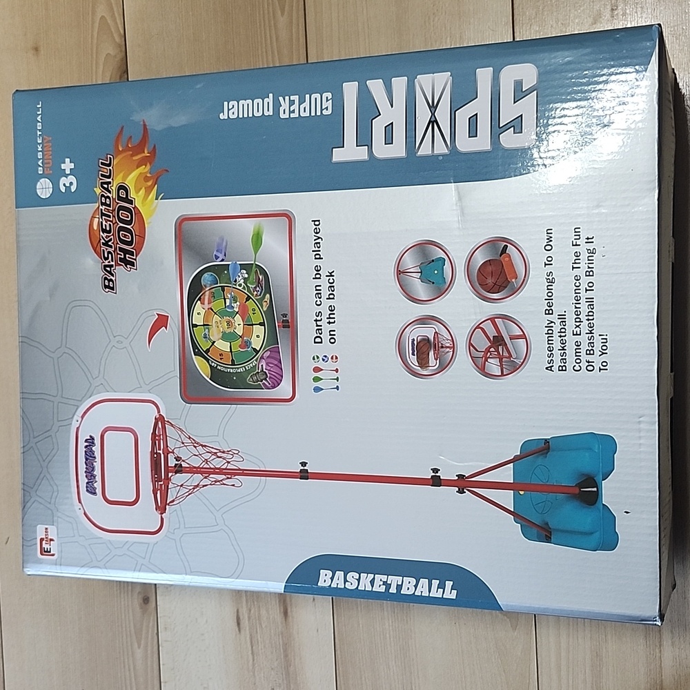 Basketball hoop + darts can be played on the back
